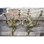 Two pairs of gilt brass twin-branch wall sconces in the Rococo manner