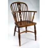 An antique elm Windsor armchair