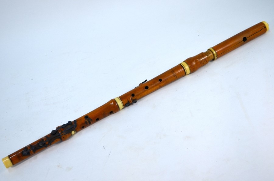 A 19th century boxwood and ivory flute