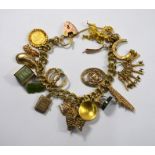 A 9ct yellow gold double curb charm bracelet