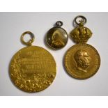 An 1897 German gilt bronze medal and other medals