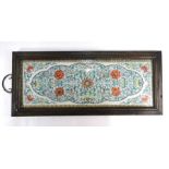 A Chinese porcelain doucai rectangular plaque decorated with bold floral designs