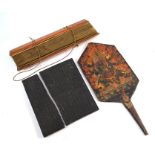 A Tibetan painted wood paddle, a Buddhist Pali text and a carved panel