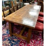 A contemporary oak refectory dining table