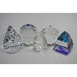 Four Swarovski Crystal paperweights and an egg