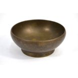 A circular bronze bowl