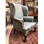 A 19th century George II style wingback armchair
