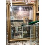 An antique French arched top giltwood mirror