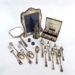 A silver-faced easel mirror, an Art Deco hand-mirror and other oddments of silver