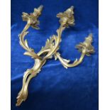 A gilt brass foliate three-branch wall-sconce in the Rococo manner