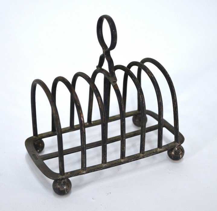 A silver toast rack,Thomas Bradbury & Son, Sheffield 1923