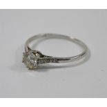 A white metal set diamond ring