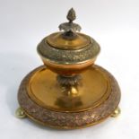 A 19th century Continental circular brass and copper inkstand