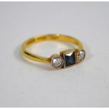 An antique sapphire and diamond three stone ring