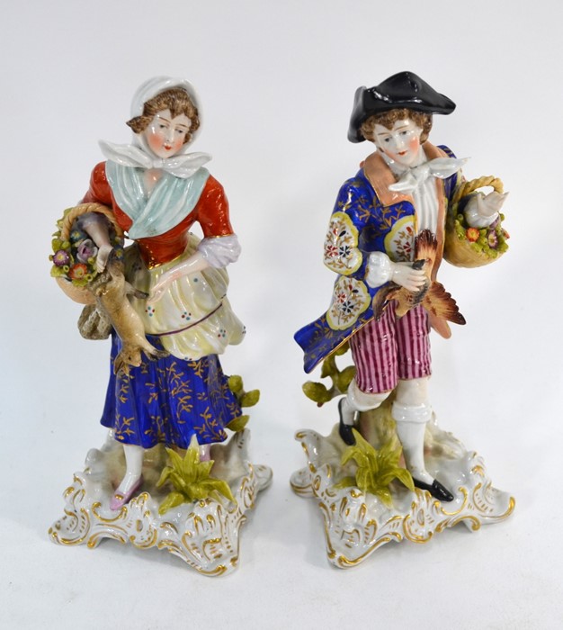 A pair of Naples porcelain figures