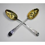 A pair of silver berry spoon