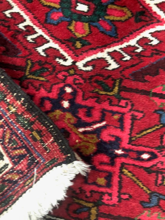 A Persian Hamadan red ground diamond lozenge design rug - Image 2 of 2