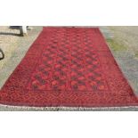 A large old Turkoman red ground carpet