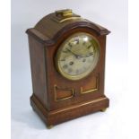 Leeds Goldsmiths Co, Paris, an early 20th century walnut cased two train mantel timepiece