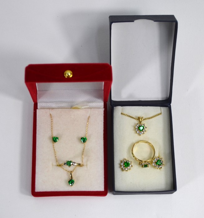 A yellow metal earring, ring and pendant suite