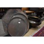 A collection of Middle Eastern metal ware to include an octagonal tray on folding wooden stand,