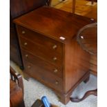 A small mahogany chest of four drawers raised on bracket feet