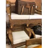 An Ikea Arholma wicker conservatory suite comprising two seater sofa and pair of armchairs with