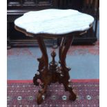 A carved mahogany occasional table with moulded marble top