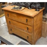 A small light oak chest of three long drawers