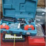 Makita 8391D cased combi drill with two batteries and charger, Hitachi 110v disc cutter, Newsome