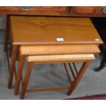 A nest of three Danish Mobele teak tables with octagonal supports and stretchers