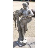 A weathered composite/stone-crete cast garden statue of a classical female