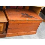 A stained pine carpenter's tool chest with hinged top enclosing a multi-tray fitted interior c.