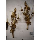 A pair of Italian foliate gilt four-branch wall light sconces