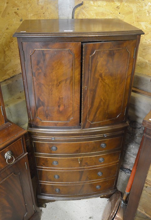 A mahogany bow front cocktail cabinet
