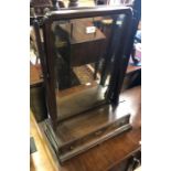 A 19th Century mahogany framed platform mirror with three drawers (damages)