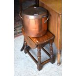 A small oak drop leaf table to/w an antique copper twin handled preserve pan and cover