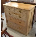 A beech chest of two short over three long drawers