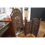 A foliate carved wood four-panel folding screen to/w a Chinese dragon carved panel (formerly chair