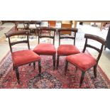 A set of four Regency mahogany trafalgar back dining chairs with turned and reeded front legs and