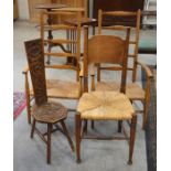 A pair of rush seated ladder back open arm chairs to/w oak arts and crafts rush seated chair and a