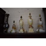 Two matching cream alabaster table lamps, two other white alabaster table lamps, to/w a Comitti of