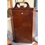 A large 19th century mahogany hanging corner cupboard (A/F)