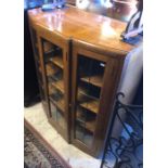 An Art Deco golden oak display cabinet/bookcase, with three lead glazed doors