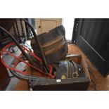 A collection of vintage heavy horse tack to include hames, brass studded leather and wood pannier