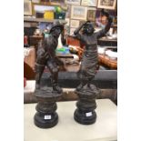 A pair of 19th century spelter figures depicting a fisherman and his wife waving farewell