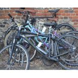 A Raleigh Urban 3 hybrid bike, Giant Tourer mountain bike (missing front wheel) a Mango hybrid