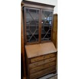 A 19th century mahogany bureau bookcase with astragal glazed doors and a fall front panel with 'H'