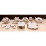 Carlton Ware 'Sunshine' pattern tea service , comprising:  teapot and cover, milk jug, 10 teacups,