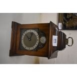 A walnut cased mantel clock with motto 'Tempis Fugit'